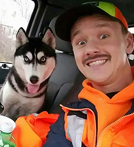 Photo of FIRST driver Mike Howe and Siberian Husky he saved.